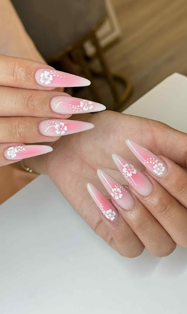 Pink ombre stiletto nails with hand-painted white floral art by Five Star Nails